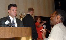 Laz, Emcee talking with audience member